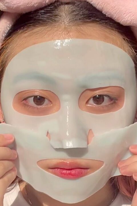 woman with skin care face mask on her face